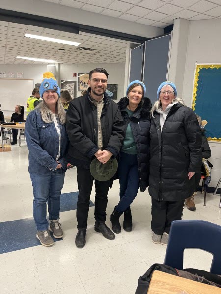 Anna Hopkins with volunteers at a community gathering