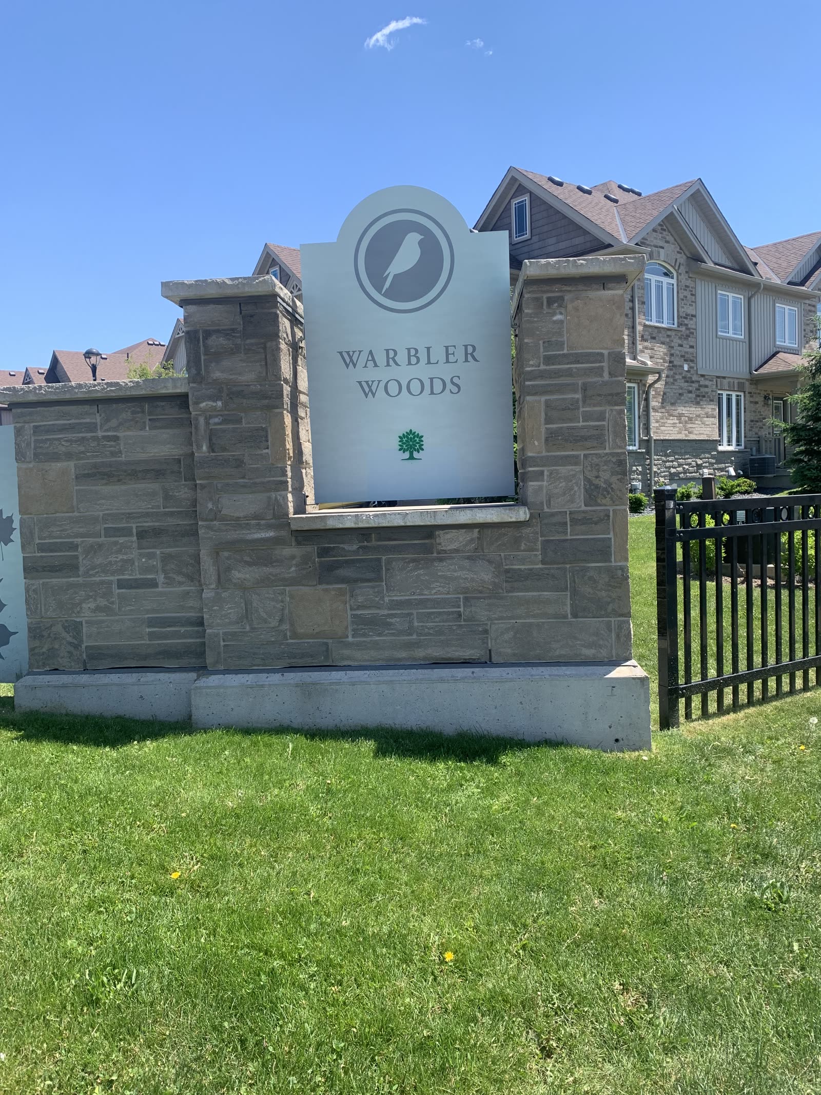 Warbler Woods neighbourhood entrance sign